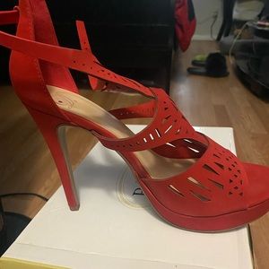 Red heel with pattern on front cris cross straps